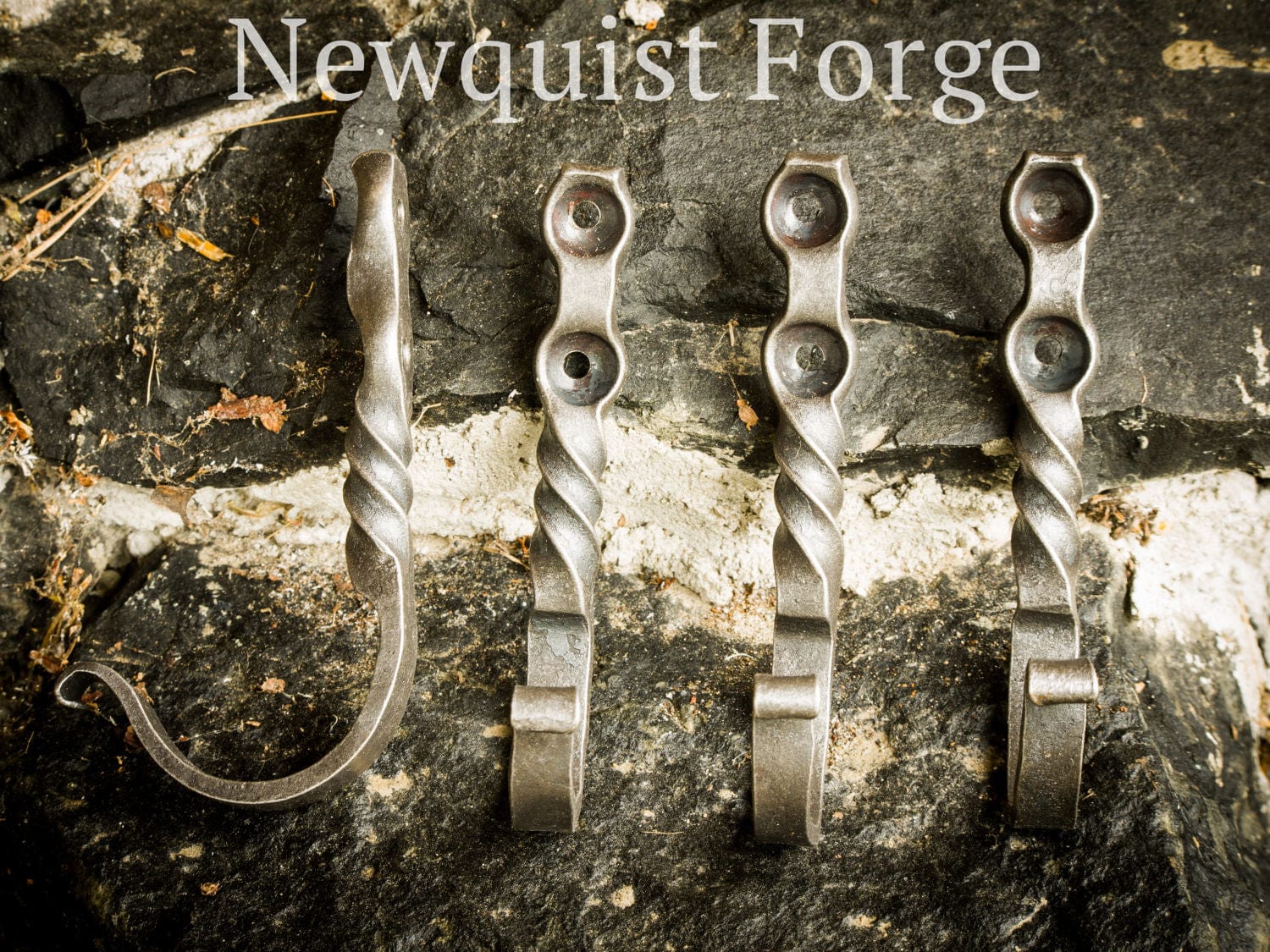 http://www.newquistforge.com/cdn/shop/products/wrought-iron-wall-hooks-set-of-four-newquist-forge-20297326100640.jpg?v=1673027262