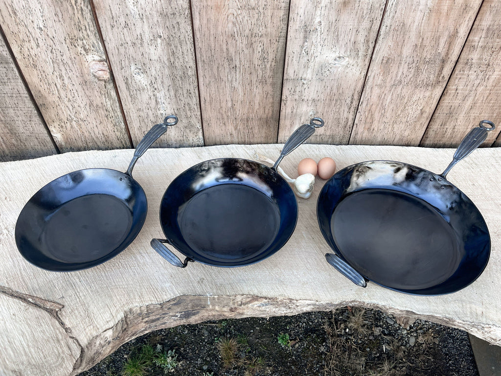 https://www.newquistforge.com/cdn/shop/products/11-carbon-steel-french-skillet-carbon-steel-pan-hand-forged-cookware-newquist-forge-newquist-forge-36650240180469_1024x.jpg?v=1695667964